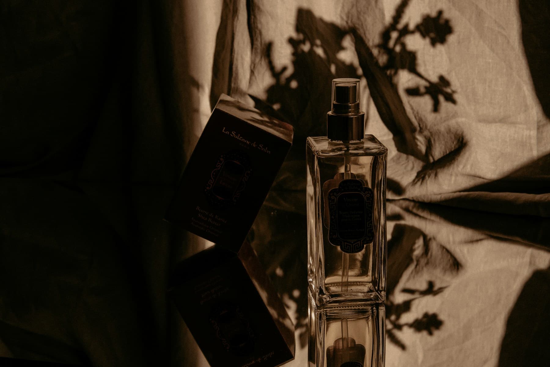 An elegant fragrance bottle styled as a gift